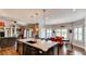 Spacious living room flows seamlessly into the open kitchen and dining area with high ceilings at 18376 Heavens Pl, Monument, CO 80132