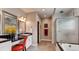 Bright and modern main bathroom features a double vanity, large shower and separate tub at 18376 Heavens Pl, Monument, CO 80132