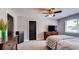 Relaxing primary bedroom with a large window, dark dresser, and comfortable bed at 18376 Heavens Pl, Monument, CO 80132