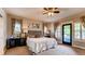 Relaxing main bedroom with ensuite bathroom and walk out to the patio at 18376 Heavens Pl, Monument, CO 80132