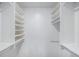 Organized walk-in closet with multiple shelves and rods, maximizing storage space at 2203 S Holly St # 3, Denver, CO 80222