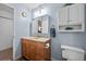 Bathroom with a vanity, toilet and linen cabinet at 12564 W Virginia Ave, Lakewood, CO 80228