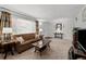 Living room with neutral carpeting and large windows at 12564 W Virginia Ave, Lakewood, CO 80228