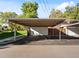 Covered carport parking space with additional storage at 12564 W Virginia Ave, Lakewood, CO 80228