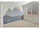 Bedroom features a custom mural, carpeted floors, and a window at 971 Parsons Ave, Castle Rock, CO 80104
