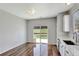 Dining area with hardwood floors and sliding glass doors leading to the backyard at 971 Parsons Ave, Castle Rock, CO 80104