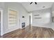 Spacious living room with hardwood floors, vaulted ceiling, fireplace and built-in shelves at 971 Parsons Ave, Castle Rock, CO 80104