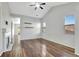 Open living room with hardwood floors, vaulted ceiling, and modern fireplace at 971 Parsons Ave, Castle Rock, CO 80104