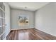 Bright office space featuring hardwood floors and a large window offering natural light at 971 Parsons Ave, Castle Rock, CO 80104