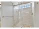 Tiled shower with glass doors and window at 971 Parsons Ave, Castle Rock, CO 80104