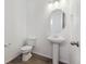 Powder room with pedestal sink and toilet at 6585 N Nepal St, Aurora, CO 80019