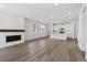 Open living room with fireplace and kitchen island view at 6585 N Nepal St, Aurora, CO 80019