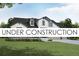 Charming two-story home with black trim, white siding, and a well-manicured front yard at 21821 E Tansy Pl, Aurora, CO 80016