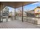 Wooden deck with railing overlooking the backyard and neighborhood at 13676 Cherry Way, Thornton, CO 80602