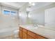 Bathroom with double sink, tub and shower at 13676 Cherry Way, Thornton, CO 80602