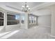 Bright dining room with bay window and chandelier at 13676 Cherry Way, Thornton, CO 80602