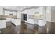 Kitchen with white cabinets, granite countertops, and an island at 13676 Cherry Way, Thornton, CO 80602