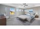 Main bedroom with plush bed and sitting area at 13676 Cherry Way, Thornton, CO 80602