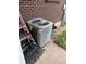 Exterior air conditioner unit next to a brick wall at 8250 Ralph Ln, Denver, CO 80221