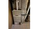 Furnace in the basement with concrete walls and floor at 8250 Ralph Ln, Denver, CO 80221