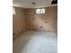 Unfinished basement space with a single window providing natural light at 8250 Ralph Ln, Denver, CO 80221