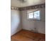 Bedroom with hardwood floors, a window, neutral walls, and baseball wallpaper border at 8250 Ralph Ln, Denver, CO 80221
