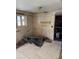 A kitchen needing remodeling with exposed walls, no cabinets, and a view from a window at 8250 Ralph Ln, Denver, CO 80221