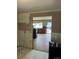 A living room needing remodeling with exposed walls and a view of the entry way at 8250 Ralph Ln, Denver, CO 80221