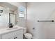 Modern bathroom with white vanity and black accents at 1749 Marlowe E Cir, Erie, CO 80516