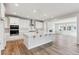 Spacious kitchen with white cabinets, island, and stainless steel appliances at 1749 Marlowe E Cir, Erie, CO 80516