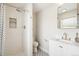 Updated bathroom features tiled shower with rainfall showerhead, and modern vanity at 1354 S Wright St, Lakewood, CO 80228
