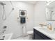 Bathroom featuring subway tile, bath tub, modern vanity, and hexagonal tile floor at 1354 S Wright St, Lakewood, CO 80228