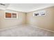 Basement bedroom features carpet flooring, neutral walls, and natural light at 1354 S Wright St, Lakewood, CO 80228