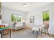 Light-filled room with windows and a cozy baby crib, complemented by stylish decor at 1354 S Wright St, Lakewood, CO 80228