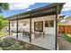 Cozy covered patio featuring decorative lighting, outdoor seating and a patterned rug at 1354 S Wright St, Lakewood, CO 80228