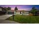Charming one-story home with a well-maintained lawn, mature trees, and an attached garage in a suburban neighborhood at 1354 S Wright St, Lakewood, CO 80228