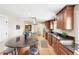 Modern kitchen with island, stainless steel appliances, and ample counter space perfect for cooking and entertaining at 1354 S Wright St, Lakewood, CO 80228