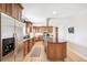 Well-equipped kitchen featuring stainless steel appliances, granite countertops, and a large island with seating at 1354 S Wright St, Lakewood, CO 80228