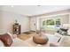 Cozy living room with hardwood floors, neutral decor, window, and comfortable seating arrangement at 1354 S Wright St, Lakewood, CO 80228