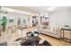 Open-concept living space featuring a dining table, seating area and stylish decor at 1354 S Wright St, Lakewood, CO 80228