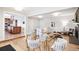 Open-concept living space featuring a modern dining table, seating area with fireplace, and stylish decor at 1354 S Wright St, Lakewood, CO 80228