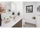 Bathroom features modern vanity and sink with a window at 2522 Zenobia St, Denver, CO 80212