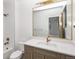 Bright bathroom features white tile and bronze fixtures at 2522 Zenobia St, Denver, CO 80212