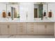 Modern bathroom featuring dual sinks and a large mirror at 2522 Zenobia St, Denver, CO 80212