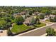Aerial view of a home in a quiet neighborhood with tree-lined streets and well-maintained lawns at 11506 Greenbriar Ln, Parker, CO 80138