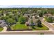 Scenic aerial view showcasing a charming home in a serene, tree-filled neighborhood at 11506 Greenbriar Ln, Parker, CO 80138