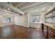 Basement with painted ceilings, updated windows, and custom bar and sink area at 11506 Greenbriar Ln, Parker, CO 80138
