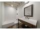 Bathroom boasts a white subway-tiled shower, dark wood vanity, and sleek finishes at 11506 Greenbriar Ln, Parker, CO 80138