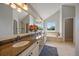Spa-like primary bathroom with a large vanity, soaking tub, walk-in shower, and tile flooring at 11506 Greenbriar Ln, Parker, CO 80138