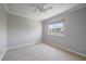 Neutral bedroom with a ceiling fan and a window providing natural light and exterior views at 11506 Greenbriar Ln, Parker, CO 80138